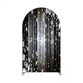 Black and silver crystal chandelier with arched frame.
